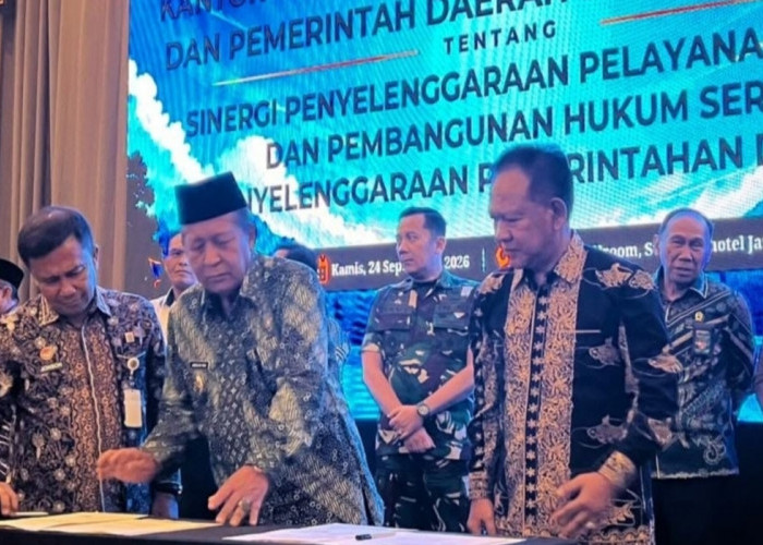 Wabup Merangin Teken MoU dengan Kementerian Hukum