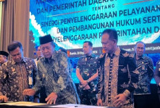 Wabup Merangin Teken MoU dengan Kementerian Hukum